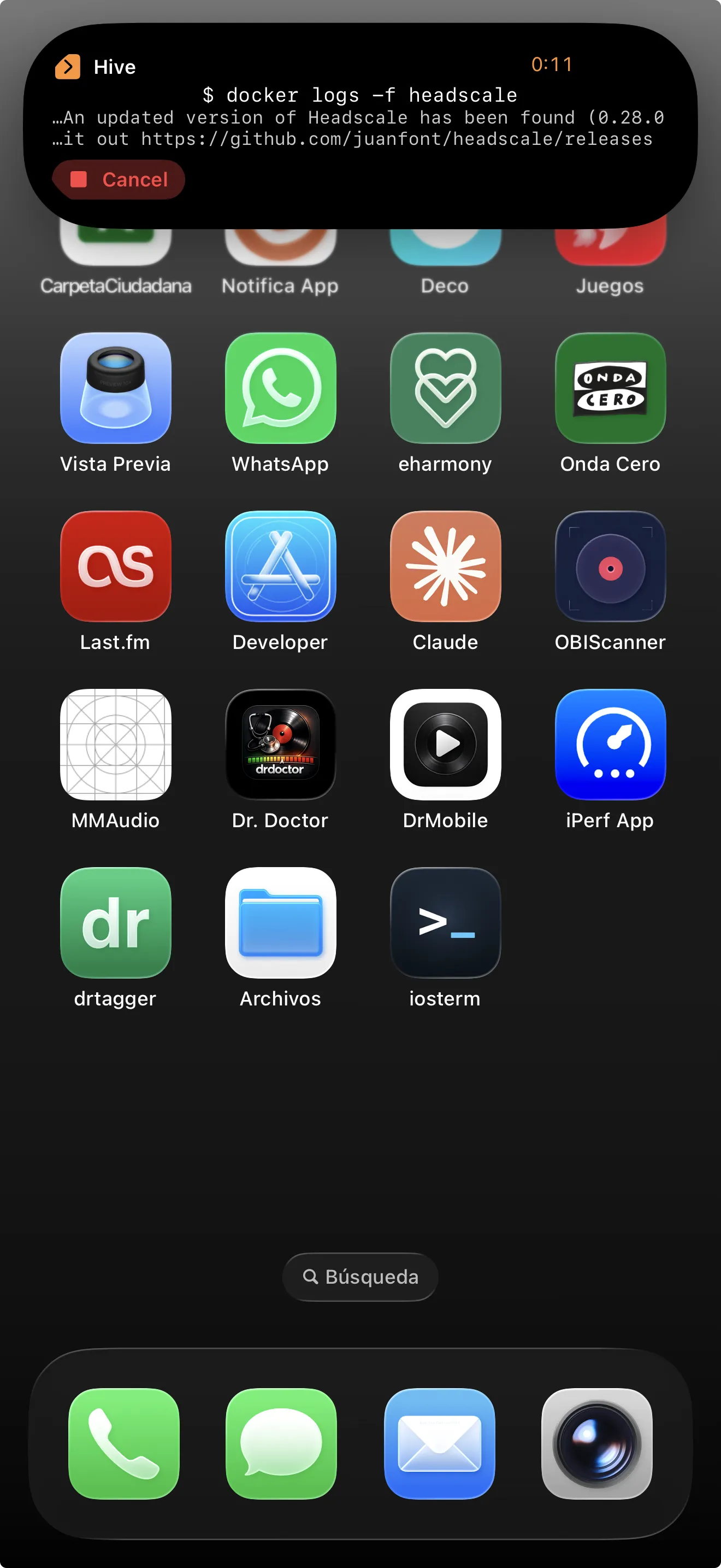 iPhone home screen with IOSTerm Dynamic Island Live Activity showing a running docker logs command on the Hive server