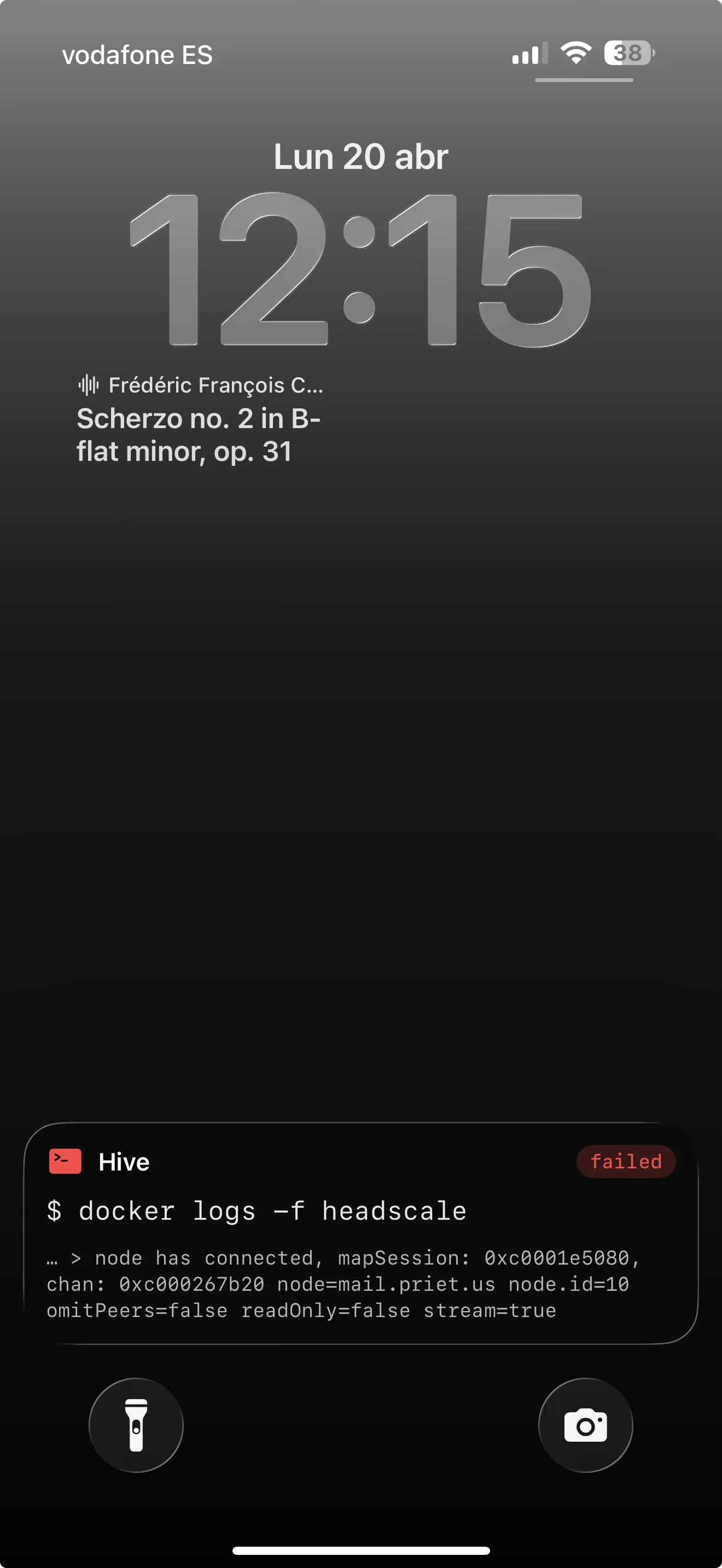 iPhone lock screen showing IOSTerm Live Activity with a failed docker logs command