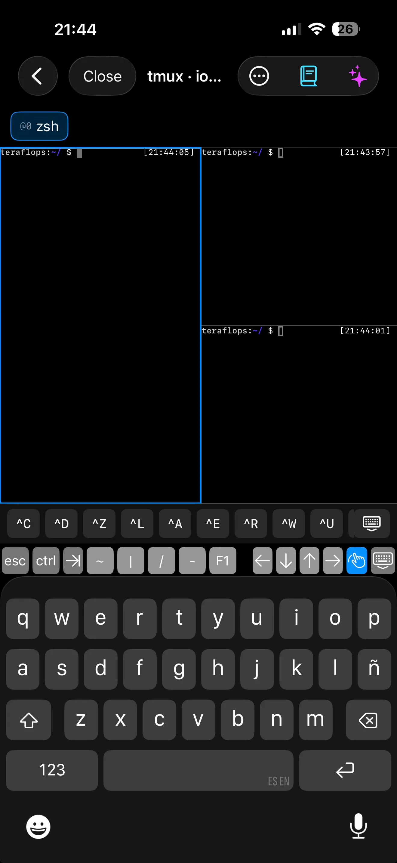 IOSTerm on iPhone showing a tmux session split into three panes with the control-key toolbar above the keyboard